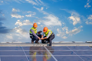 engineers ware uniform working on roof inspect and check solar c