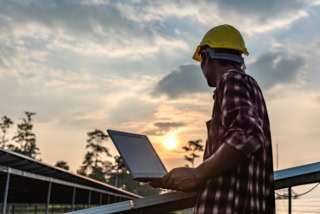 Solar panels with technicians.